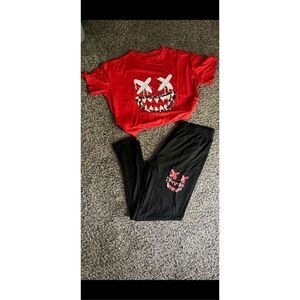 Two piece graphic, print top and bottom tag says Size XL tags says 2x but runs a